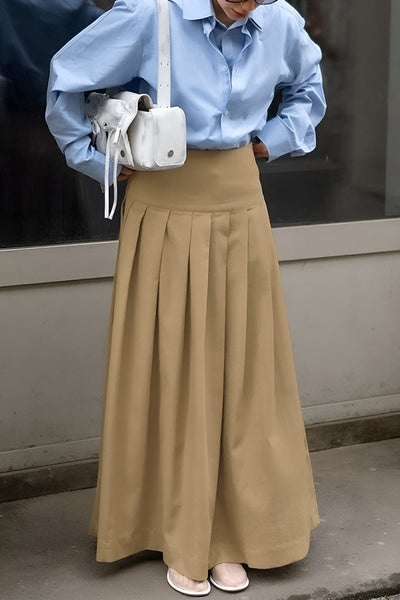 Jupe plissée taille haute, élégante, fluide et confortable, en polyester.