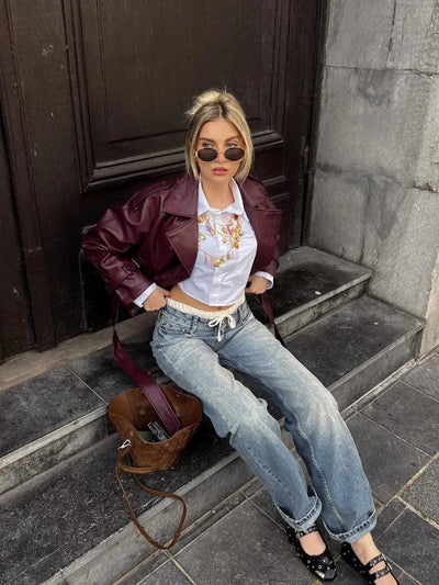 Veste droite en cuir ceinturée